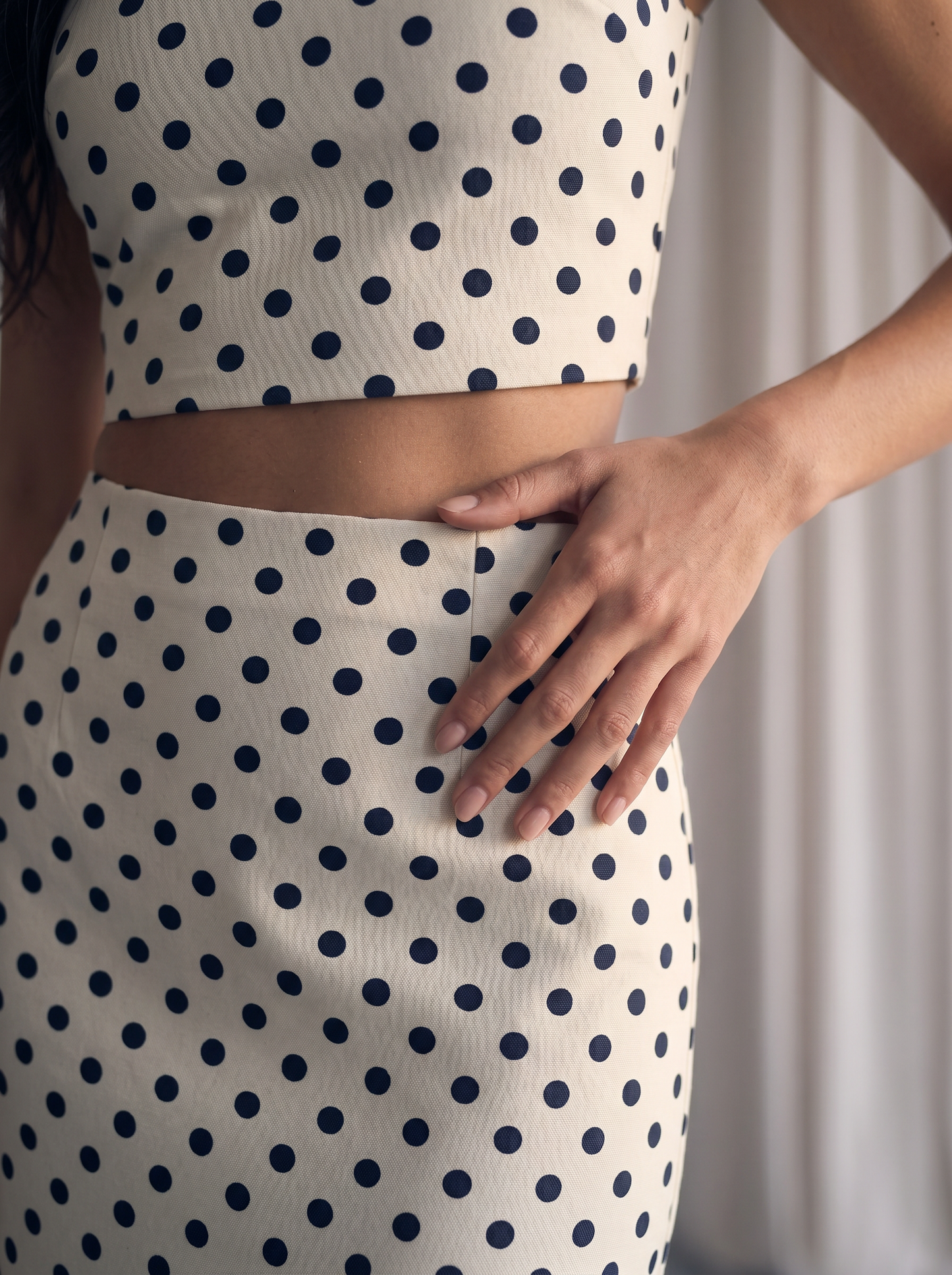Matching two-piece co-ord set with a classic black-and-white polka dot pattern